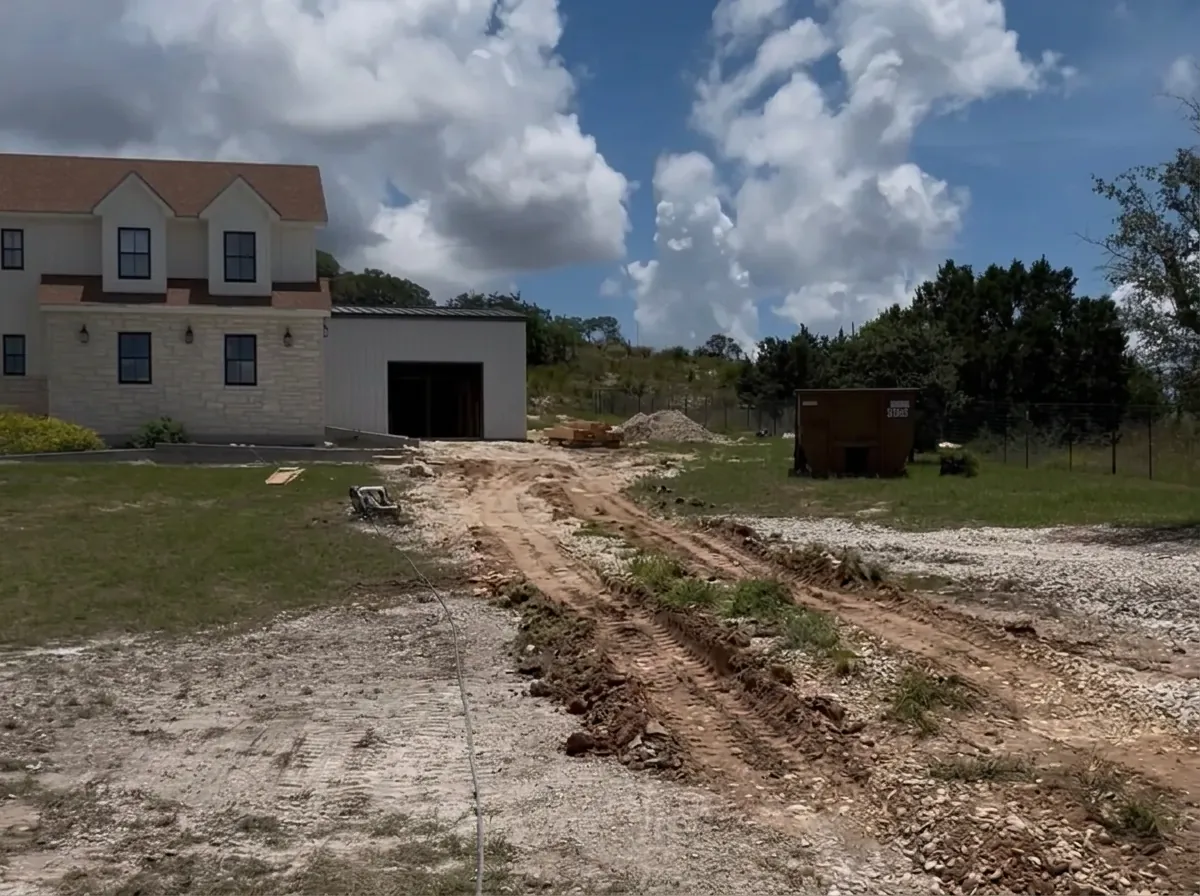 Gravel and dirt approach before the concrete driveway was poured